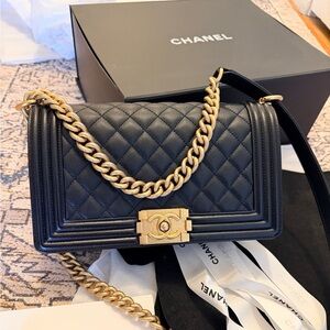 Authentic Chanel caviar grained calfskin Boy Medium black and gold hardware